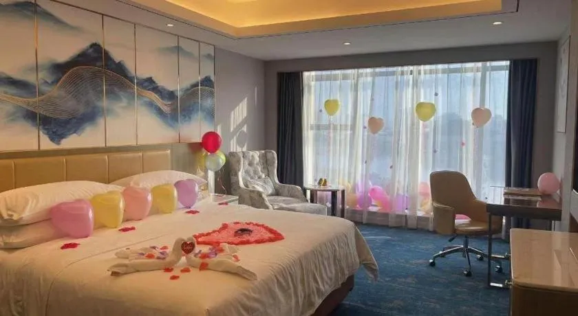 Bed in Venus Royal Hotel Guangxi Wuzhou Sanqicheng Meiguihu Park