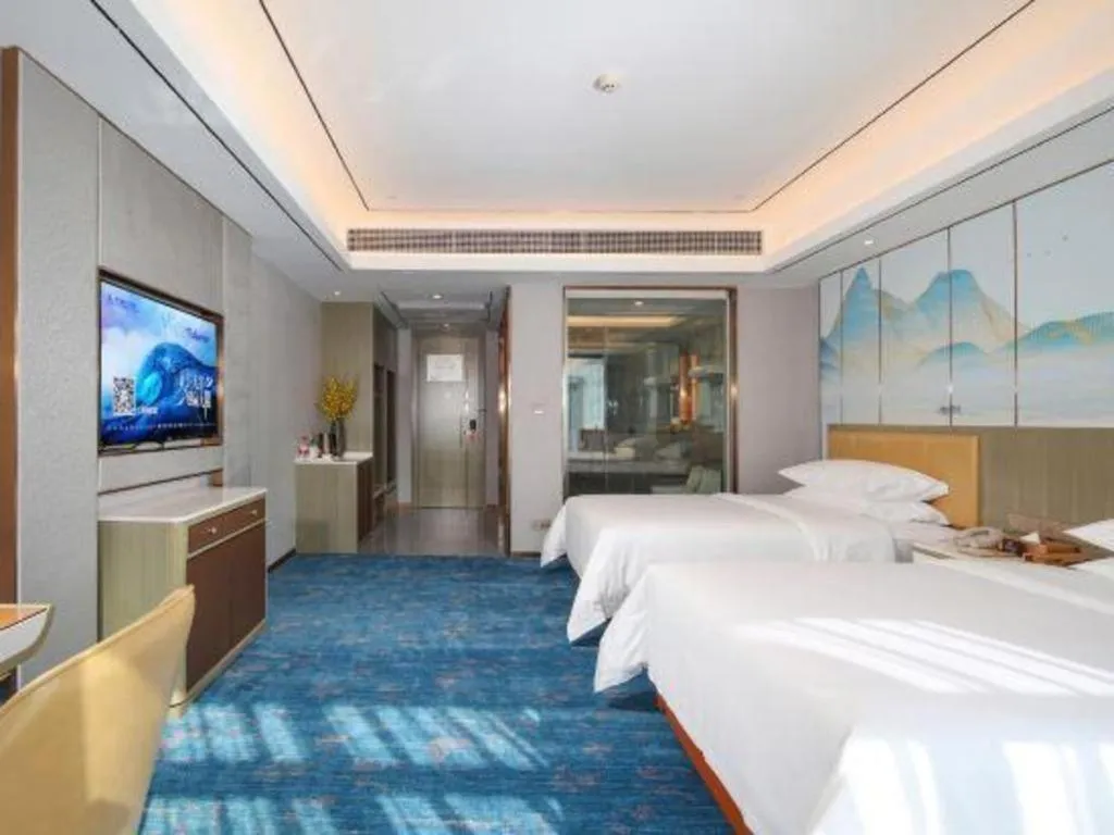 Bed in Venus Royal Hotel Guangxi Wuzhou Sanqicheng Meiguihu Park