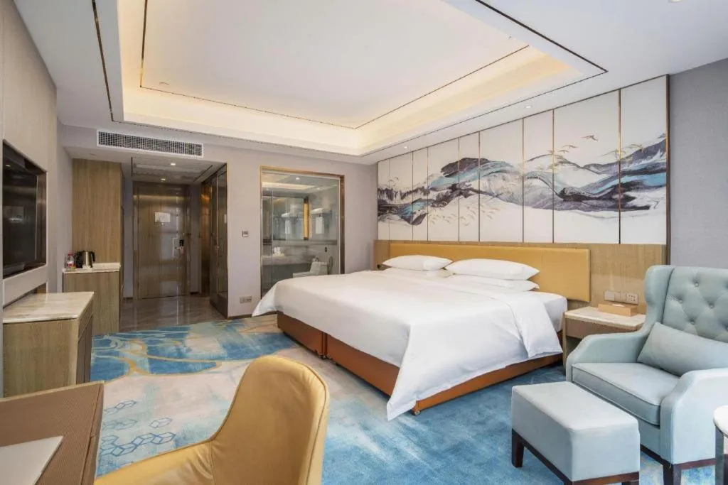 Bed in Venus Royal Hotel Guangxi Wuzhou Sanqicheng Meiguihu Park