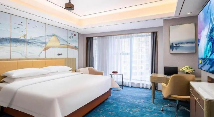 Bed in Venus Royal Hotel Guangxi Wuzhou Sanqicheng Meiguihu Park