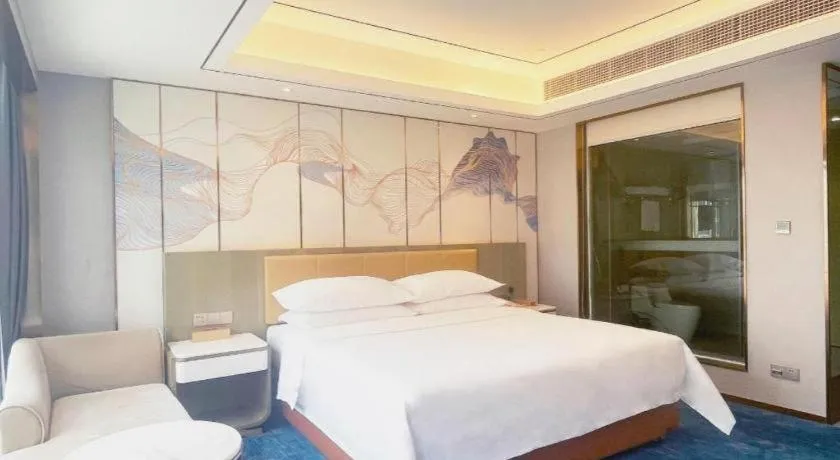 Bed in Venus Royal Hotel Guangxi Wuzhou Sanqicheng Meiguihu Park