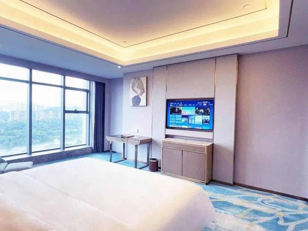 Bed in Venus Royal Hotel Guangxi Wuzhou Sanqicheng Meiguihu Park