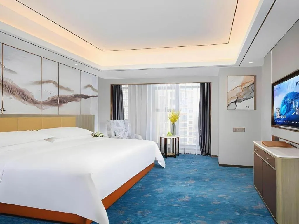 Bed in Venus Royal Hotel Guangxi Wuzhou Sanqicheng Meiguihu Park