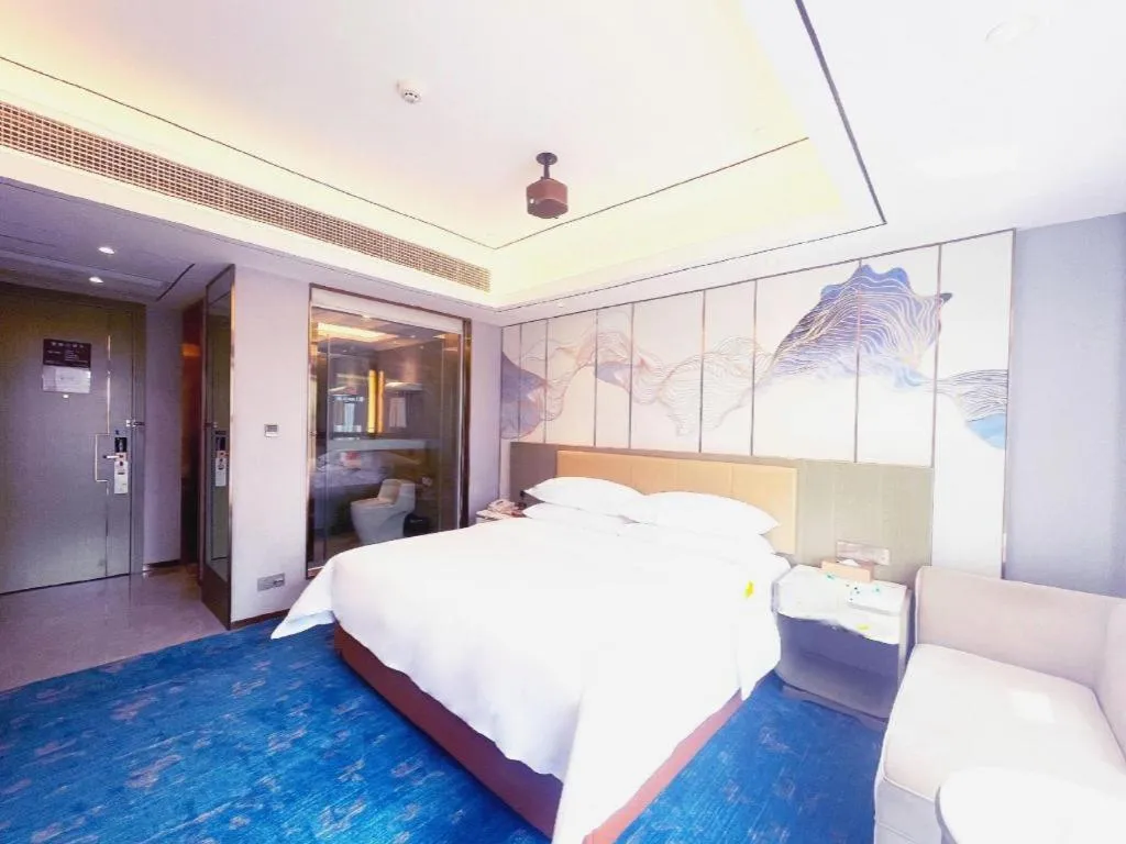 Bed in Venus Royal Hotel Guangxi Wuzhou Sanqicheng Meiguihu Park