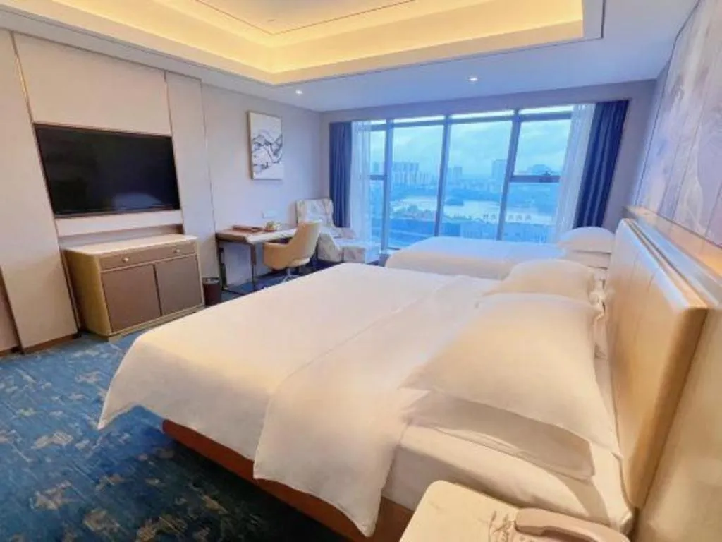 Bed in Venus Royal Hotel Guangxi Wuzhou Sanqicheng Meiguihu Park