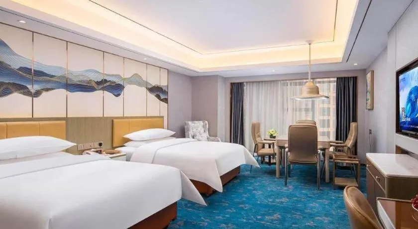 Bed in Venus Royal Hotel Guangxi Wuzhou Sanqicheng Meiguihu Park