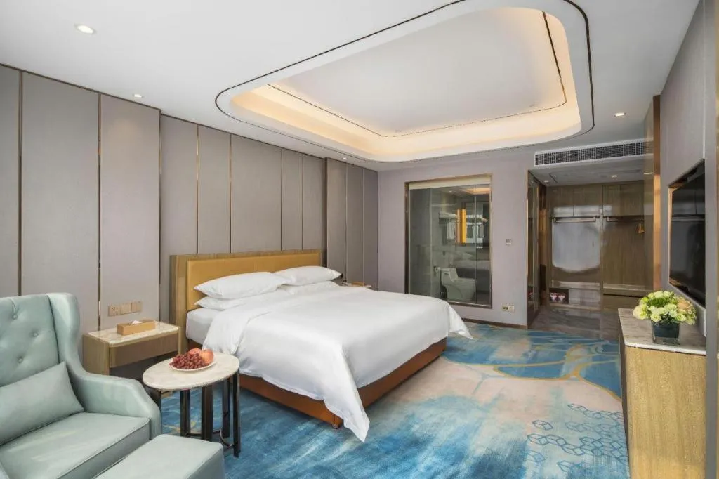 Bed in Venus Royal Hotel Guangxi Wuzhou Sanqicheng Meiguihu Park