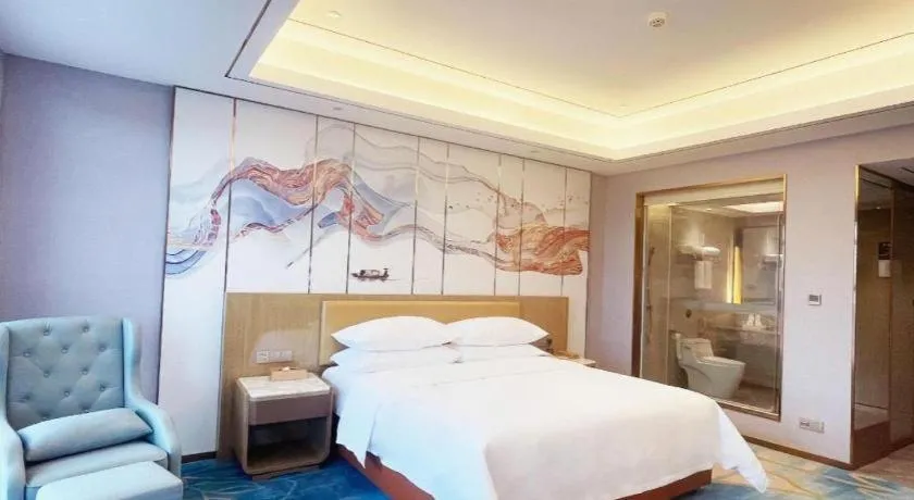 Bed in Venus Royal Hotel Guangxi Wuzhou Sanqicheng Meiguihu Park