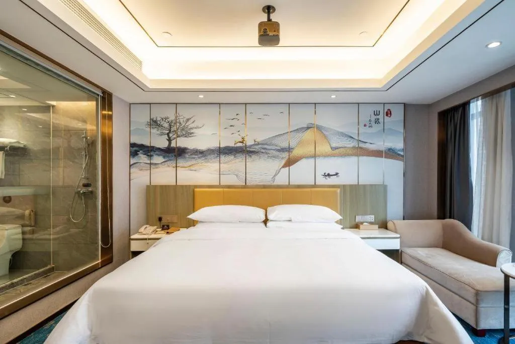 Bed in Venus Royal Hotel Guangxi Wuzhou Sanqicheng Meiguihu Park