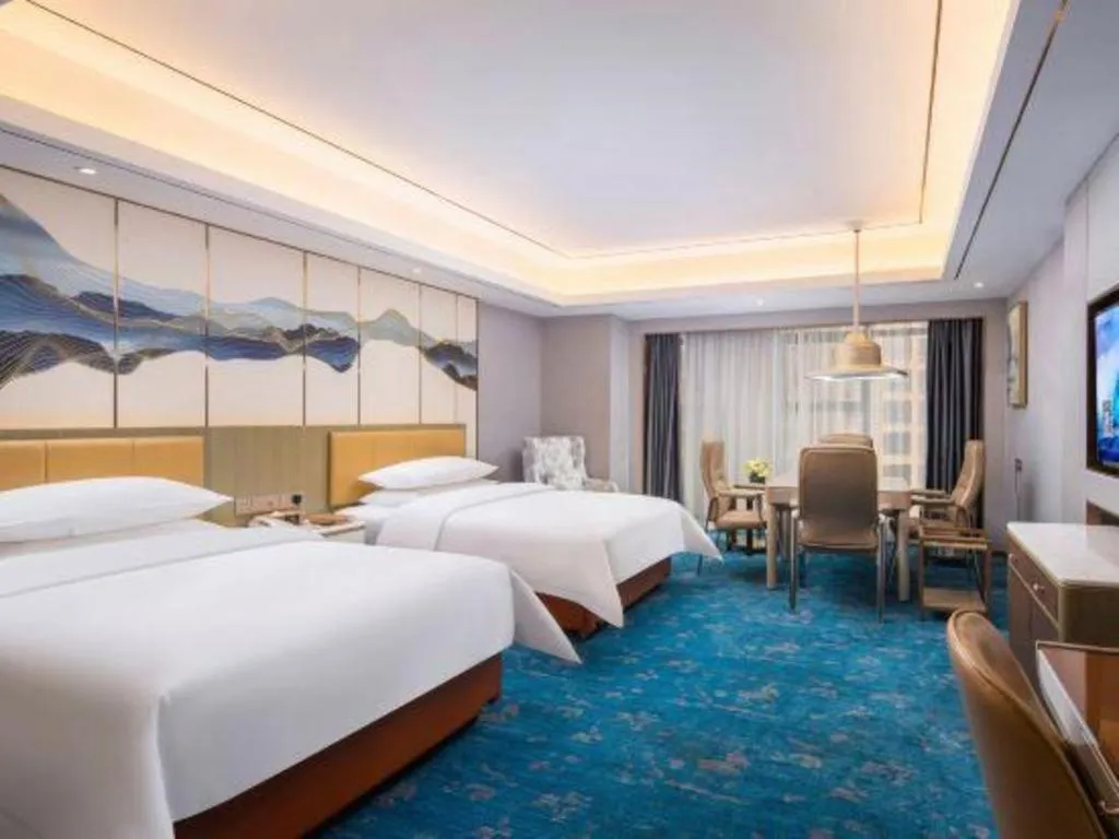 Bed in Venus Royal Hotel Guangxi Wuzhou Sanqicheng Meiguihu Park