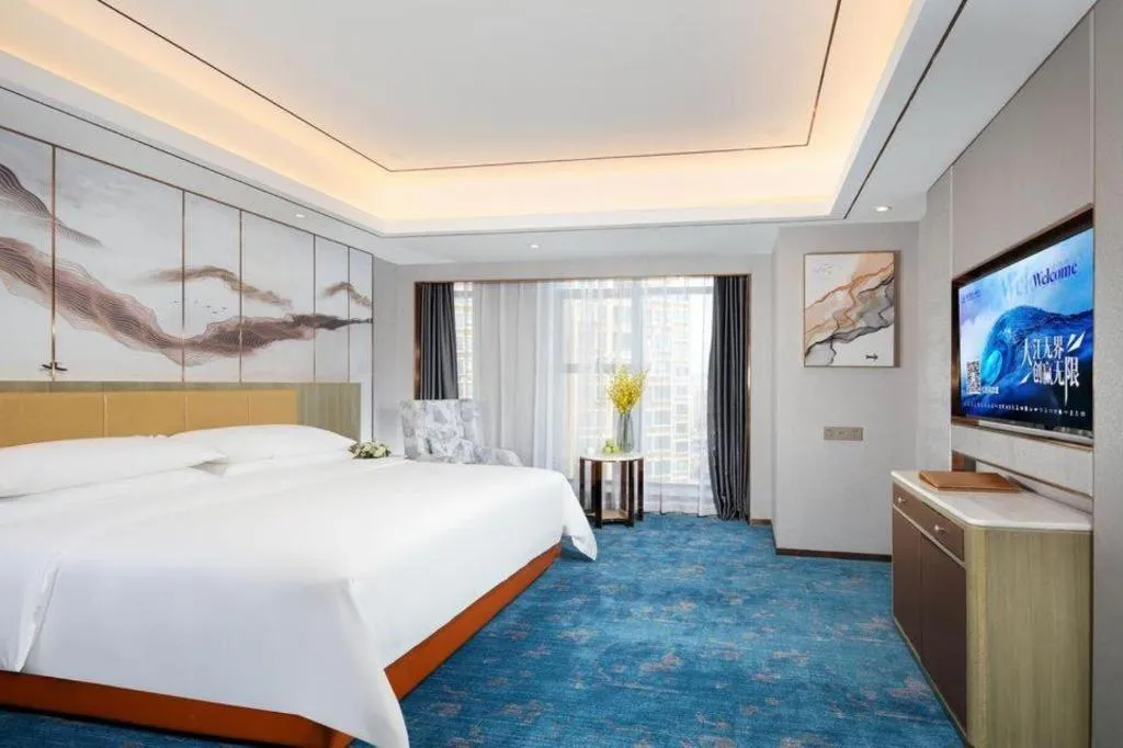 Bed in Venus Royal Hotel Guangxi Wuzhou Sanqicheng Meiguihu Park