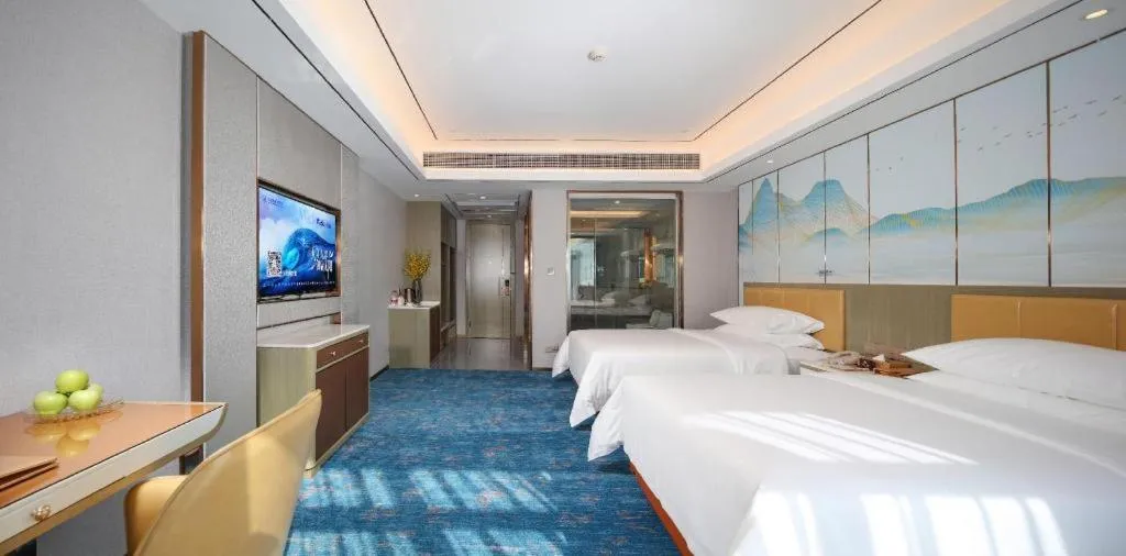 Bed in Venus Royal Hotel Guangxi Wuzhou Sanqicheng Meiguihu Park