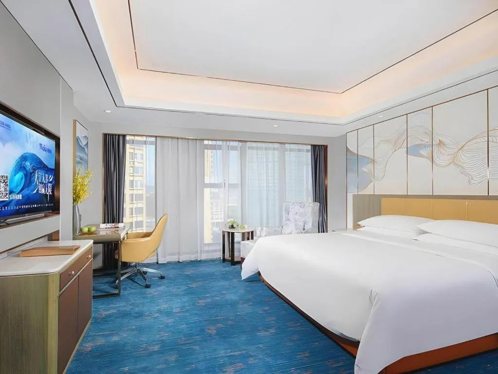 Bed in Venus Royal Hotel Guangxi Wuzhou Sanqicheng Meiguihu Park