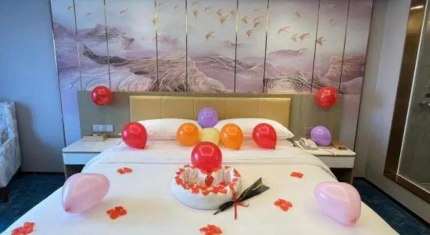 Bed in Venus Royal Hotel Guangxi Wuzhou Sanqicheng Meiguihu Park