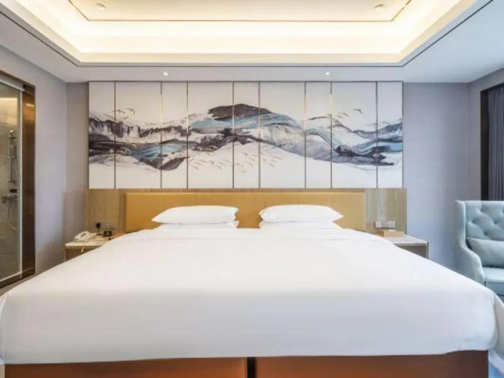 Bed in Venus Royal Hotel Guangxi Wuzhou Sanqicheng Meiguihu Park