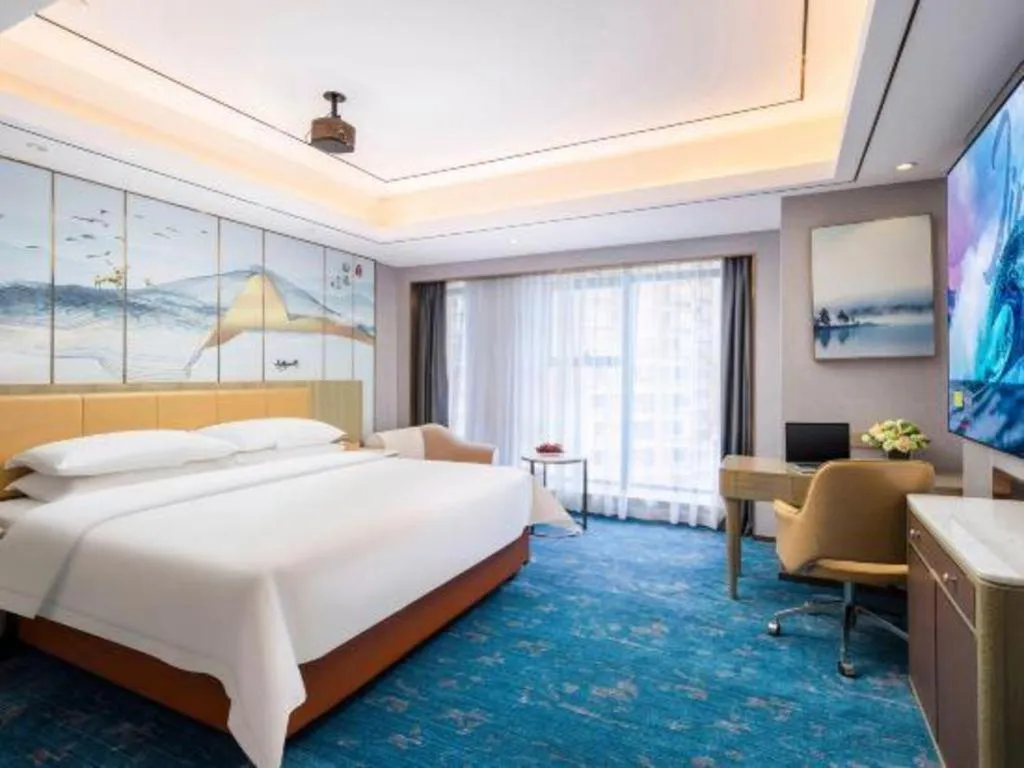 Bed in Venus Royal Hotel Guangxi Wuzhou Sanqicheng Meiguihu Park