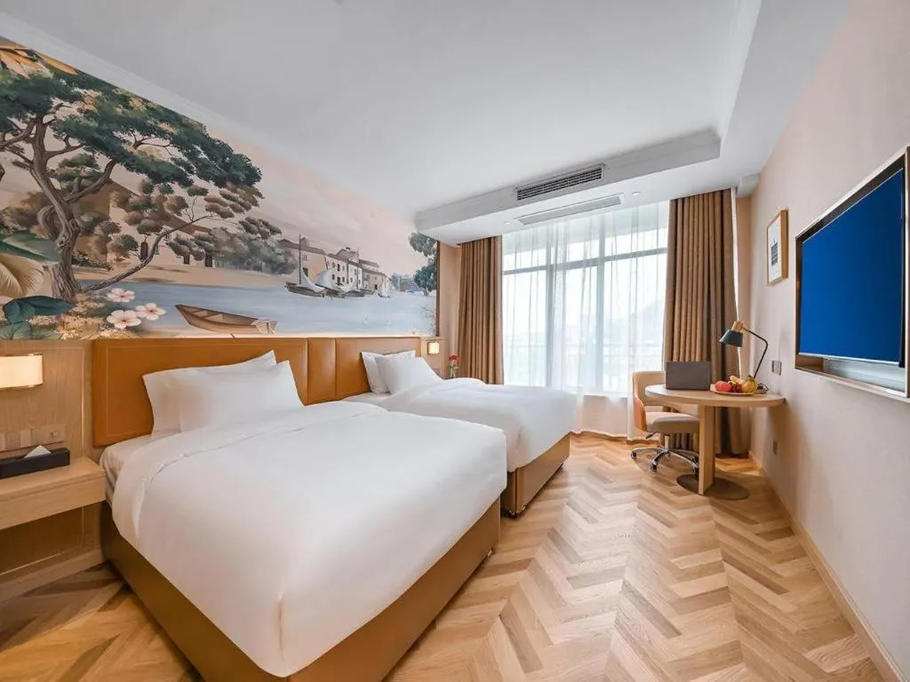 Bed in Vienna Hotel Jiangxi Ganzhou Ningdu Bus Station