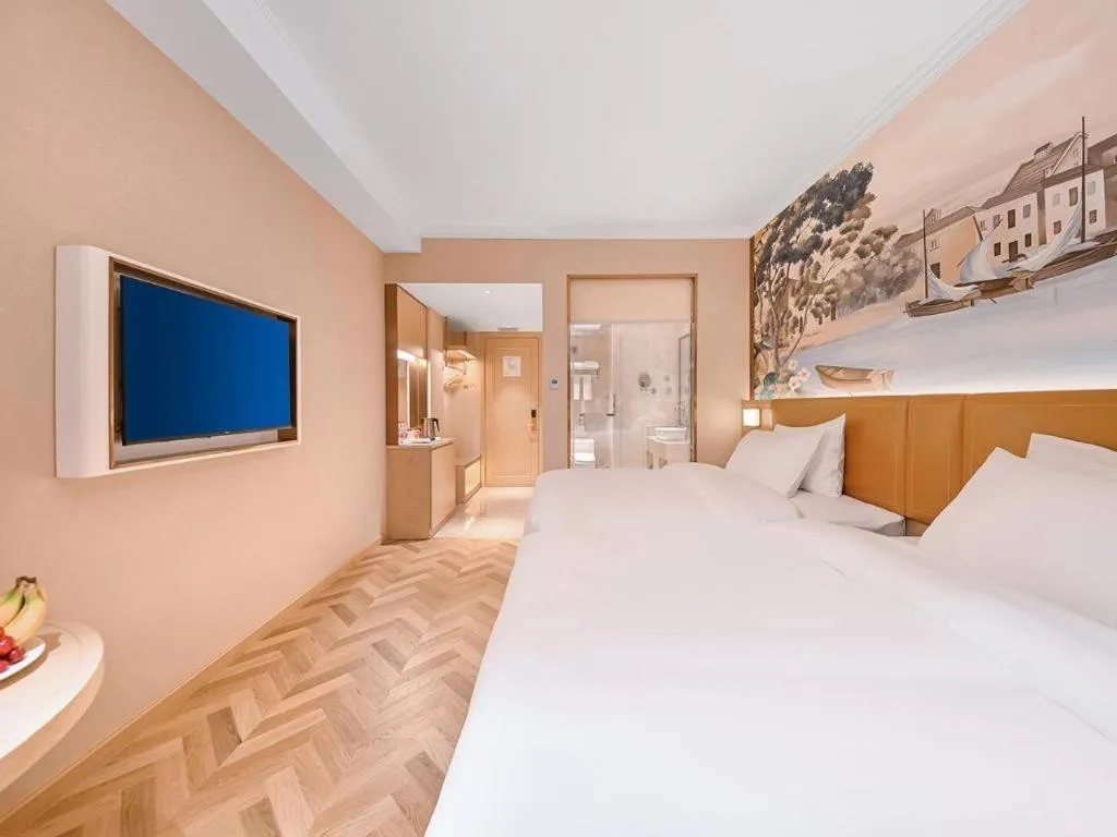 Bed in Vienna Hotel Jiangxi Ganzhou Ningdu Bus Station