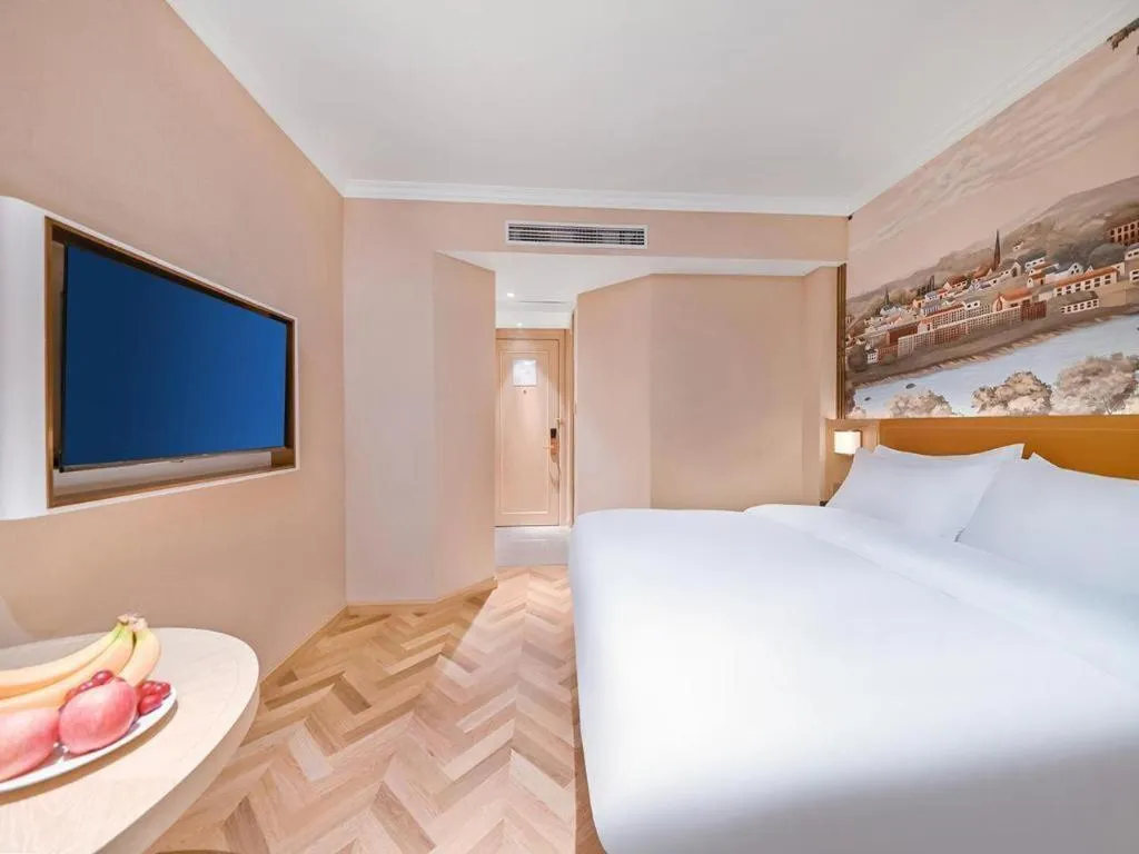 Bed in Vienna Hotel Jiangxi Ganzhou Ningdu Bus Station