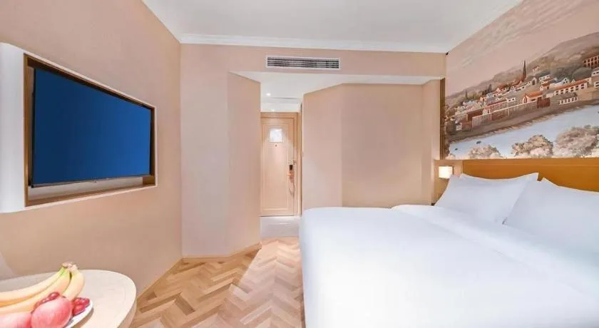 Bed in Vienna Hotel Jiangxi Ganzhou Ningdu Bus Station