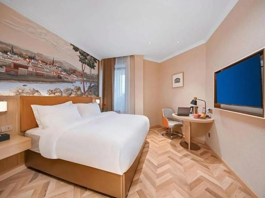 Bed in Vienna Hotel Jiangxi Ganzhou Ningdu Bus Station