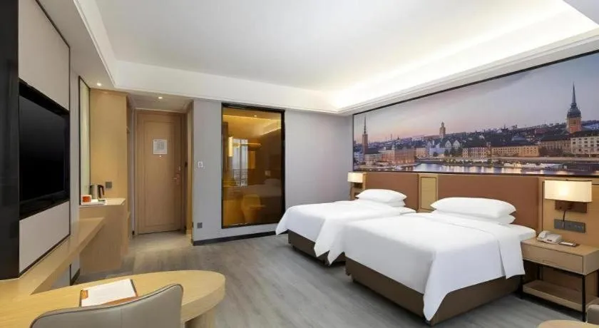 Bed in Vienna Hotel Jiangxi Shangrao High-Speed Railway Station