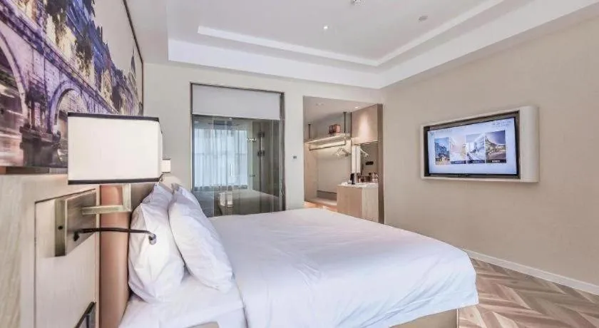 Bed in Vienna Hotel Sichuan Hejiang Yangtze River Bridge