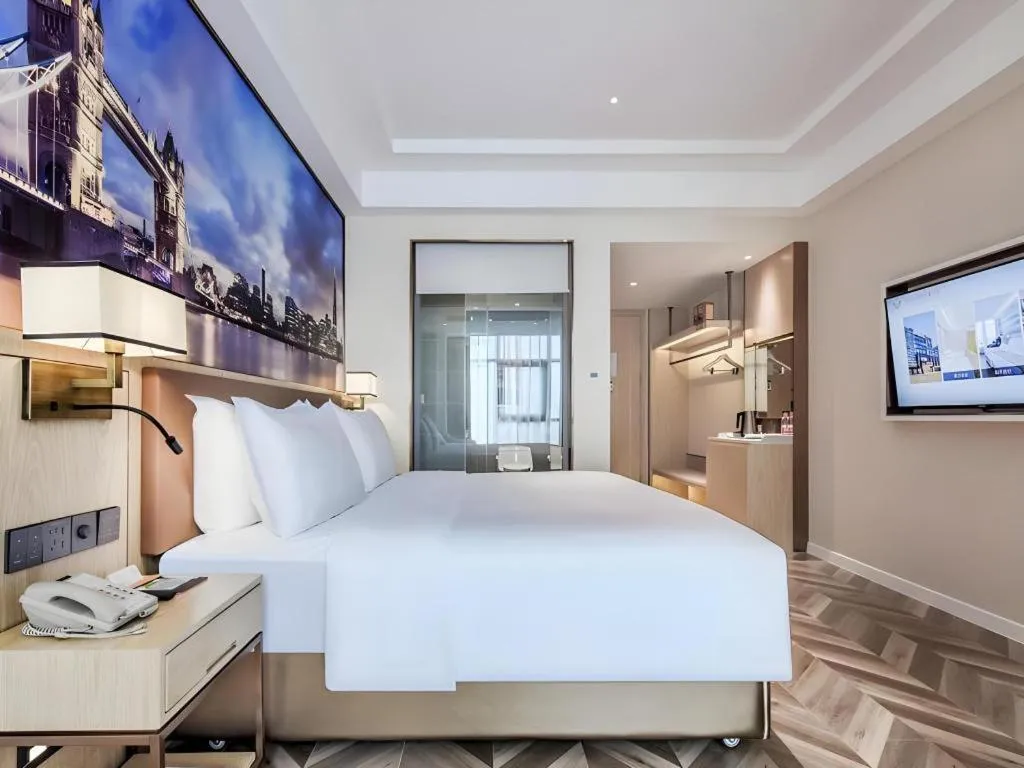 Bed in Vienna Hotel Sichuan Hejiang Yangtze River Bridge