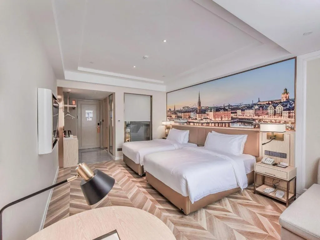 Bed in Vienna Hotel Sichuan Hejiang Yangtze River Bridge