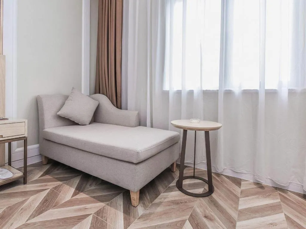 Bed in Vienna Hotel Sichuan Hejiang Yangtze River Bridge