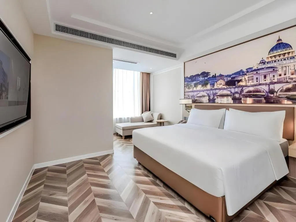 Bed in Vienna Hotel Sichuan Hejiang Yangtze River Bridge