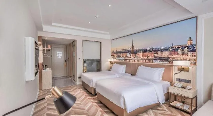 Bed in Vienna Hotel Sichuan Hejiang Yangtze River Bridge