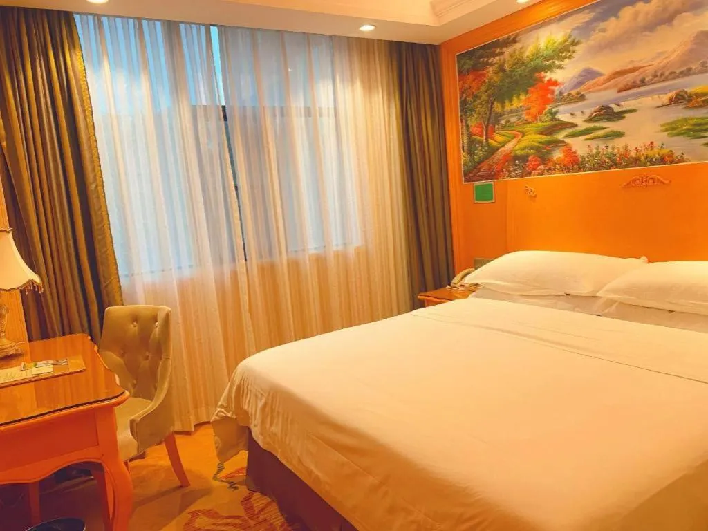 Bed in Vienna Hotel Guangxi Beiliu Passenger Station