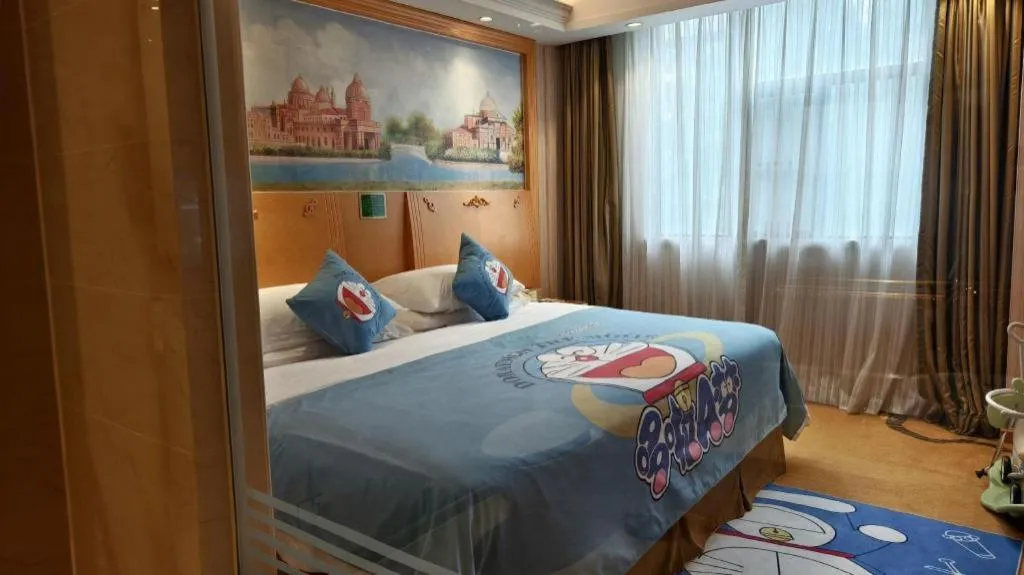 Bed in Vienna Hotel Guangxi Beiliu Passenger Station