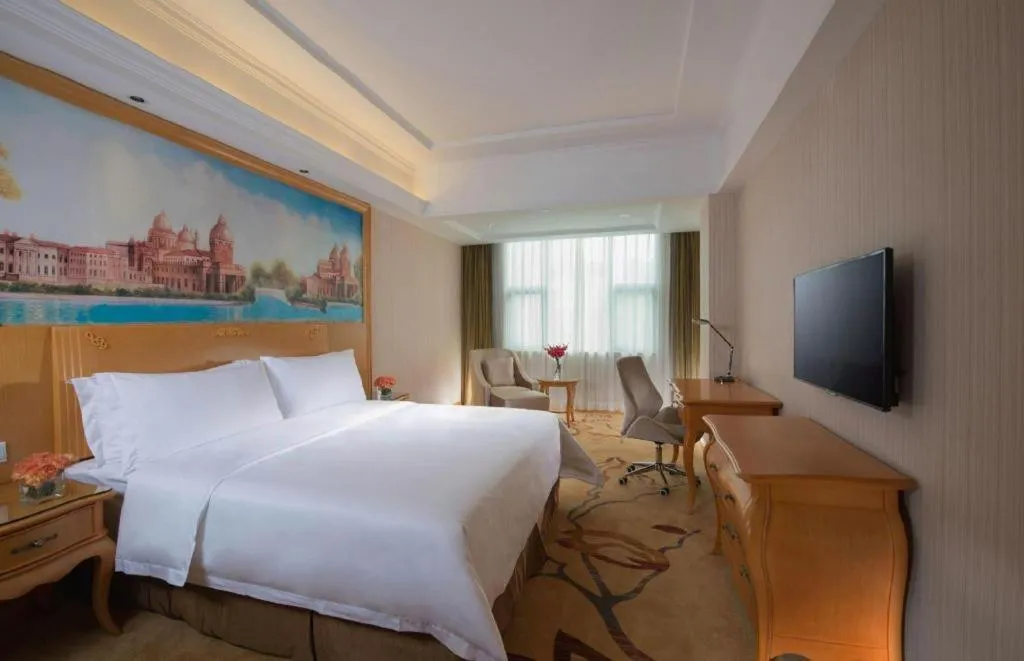 Bed in Vienna Hotel Guangxi Beiliu Passenger Station