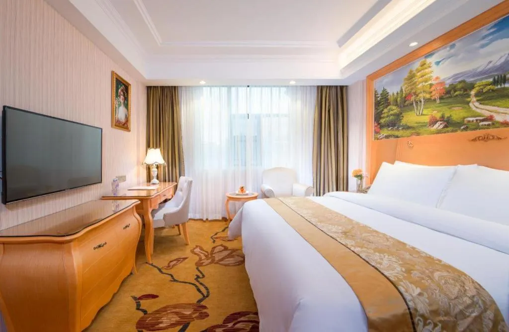 Bed in Vienna Hotel Guangxi Beiliu Passenger Station