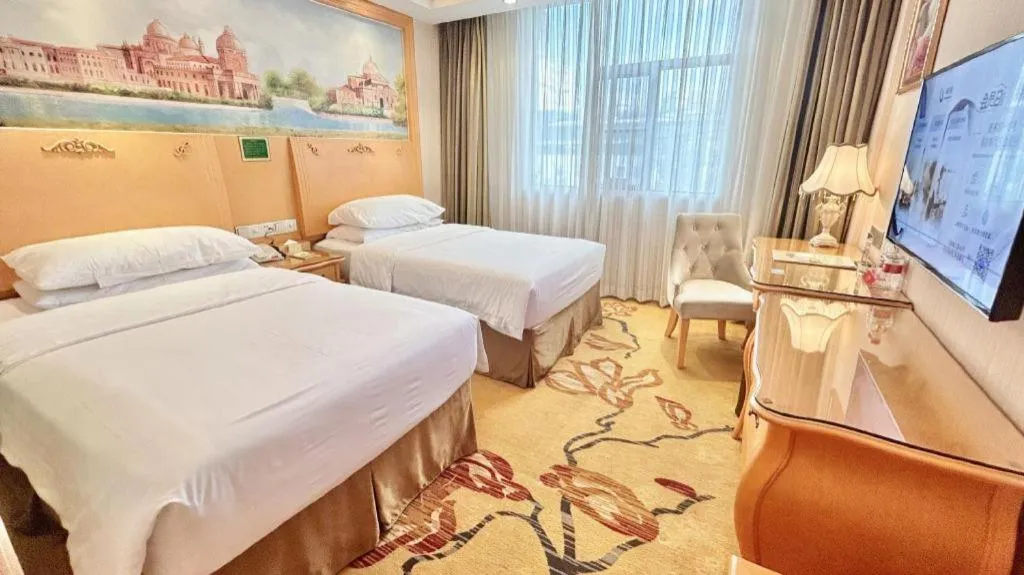 Bed in Vienna Hotel Guangxi Beiliu Passenger Station