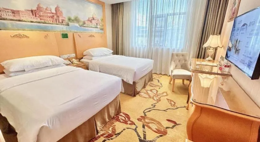 Bed in Vienna Hotel Guangxi Beiliu Passenger Station