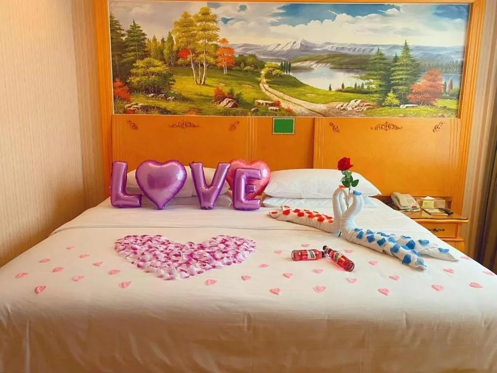 Bed in Vienna Hotel Guangxi Beiliu Passenger Station