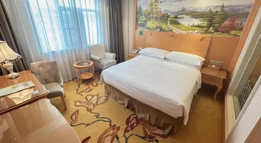 Bed in Vienna Hotel Guangxi Beiliu Passenger Station