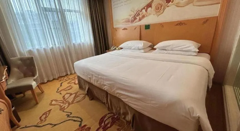 Bed in Vienna Hotel Guangxi Beiliu Passenger Station