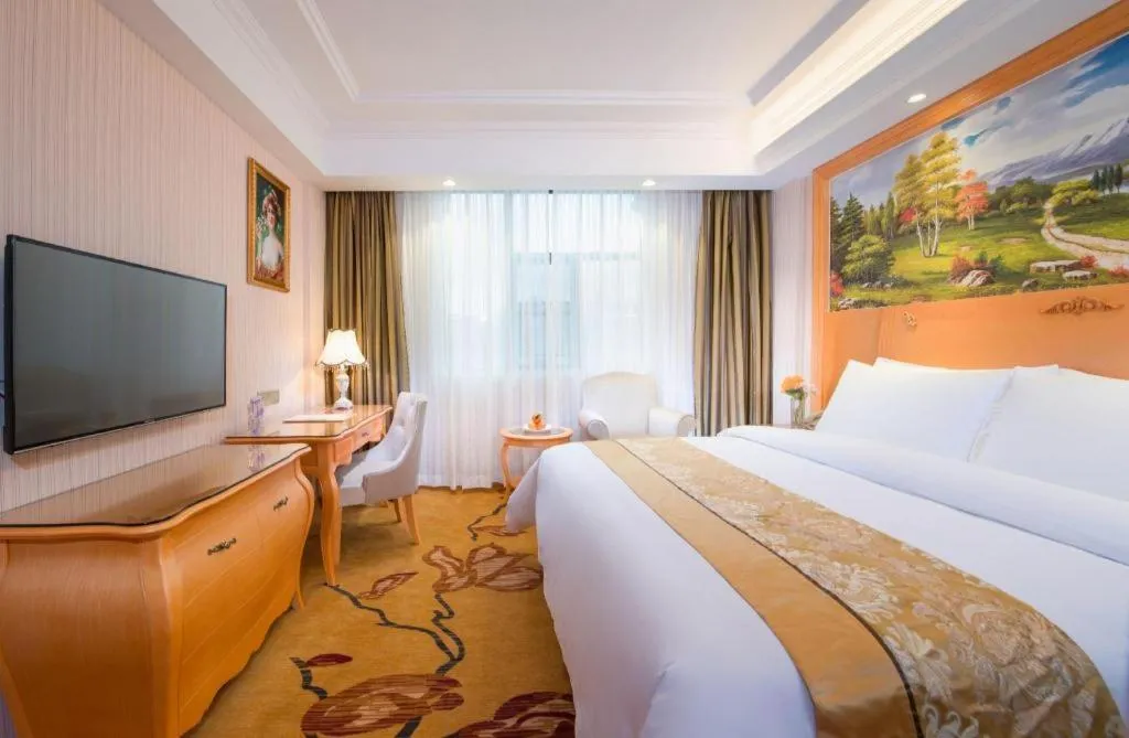 Bed in Vienna Hotel Guangxi Beiliu Passenger Station