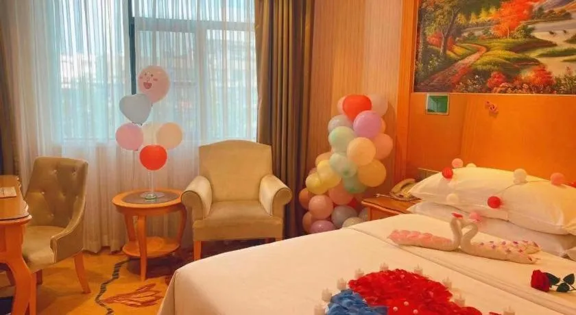 Bed in Vienna Hotel Guangxi Beiliu Passenger Station