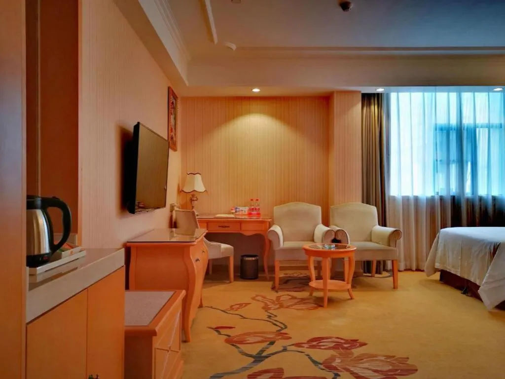 Bed in Vienna Hotel Guangxi Beiliu Passenger Station