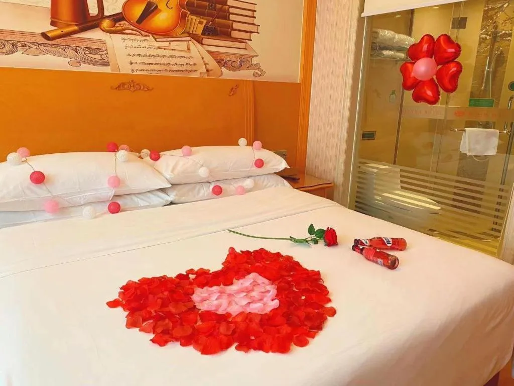 Bed in Vienna Hotel Guangxi Beiliu Passenger Station