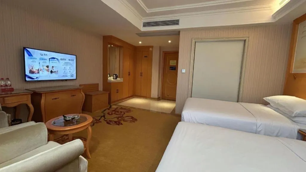 Bed in Vienna Hotel Guangxi Beiliu Passenger Station