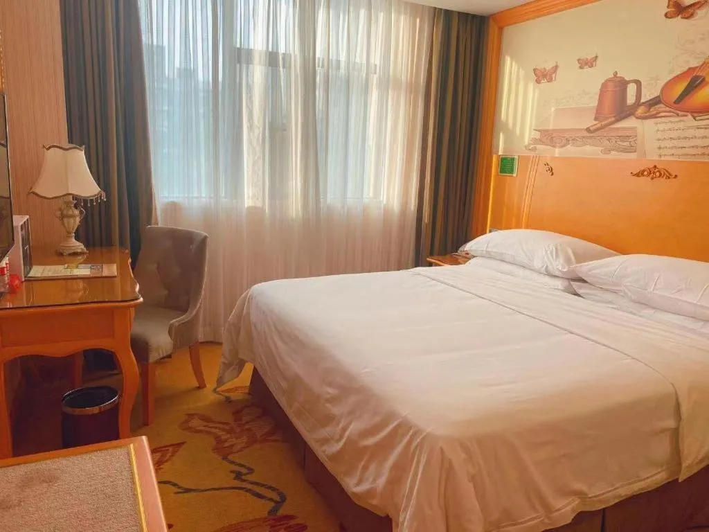 Bed in Vienna Hotel Guangxi Beiliu Passenger Station