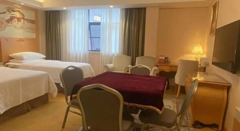 Bed in Vienna Hotel Guangxi Beiliu Passenger Station