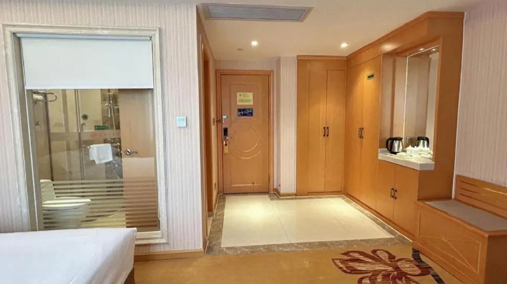 Bed in Vienna Hotel Guangxi Beiliu Passenger Station