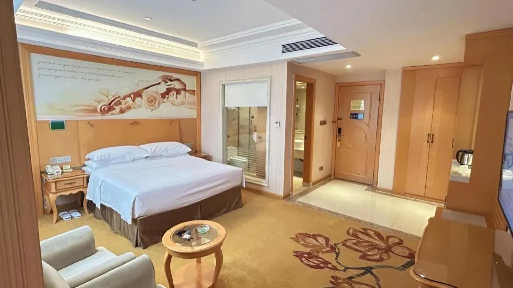 Bed in Vienna Hotel Guangxi Beiliu Passenger Station